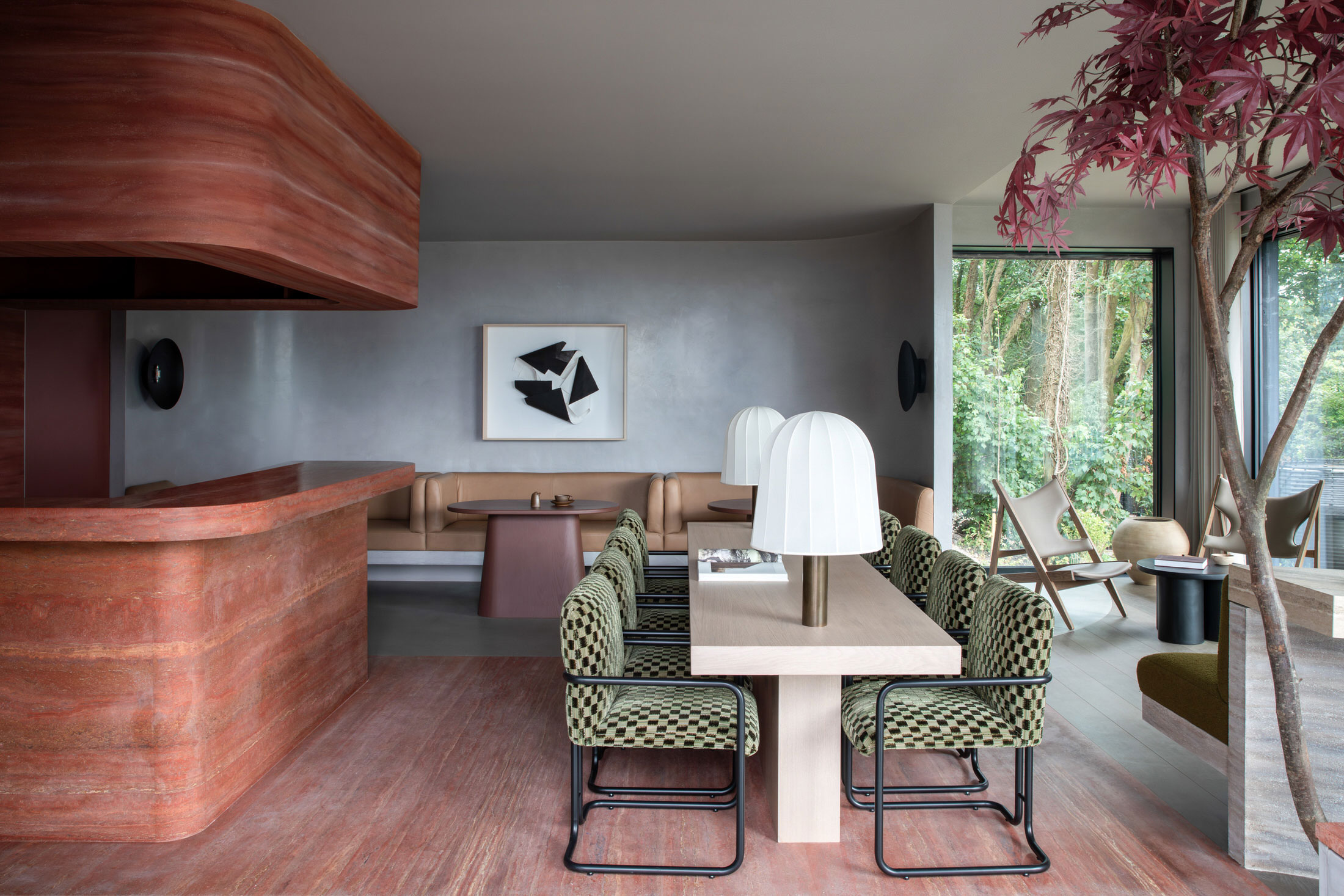 The Clubhouse interior featuring a heavy travertine bar and a distinctive green checkered pattern.