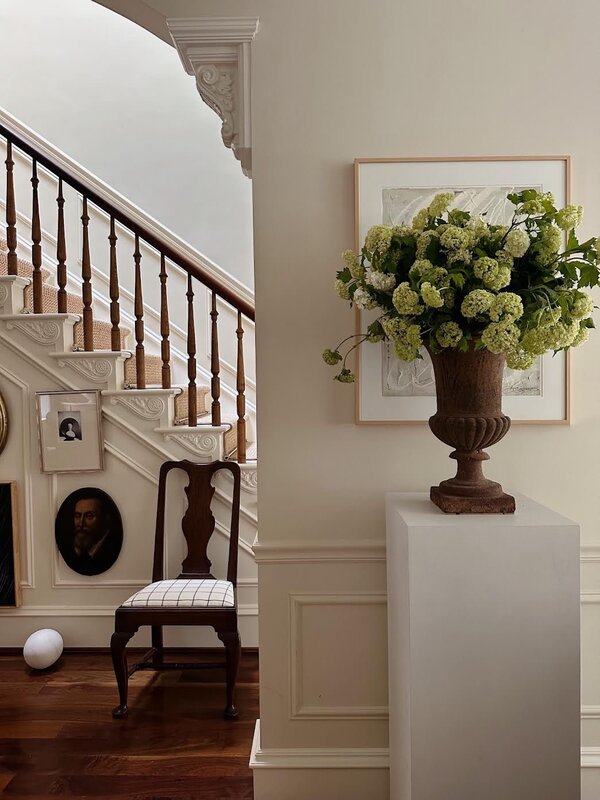 A modern room layout incorporating traditional furniture silhouettes and intricate patterns.