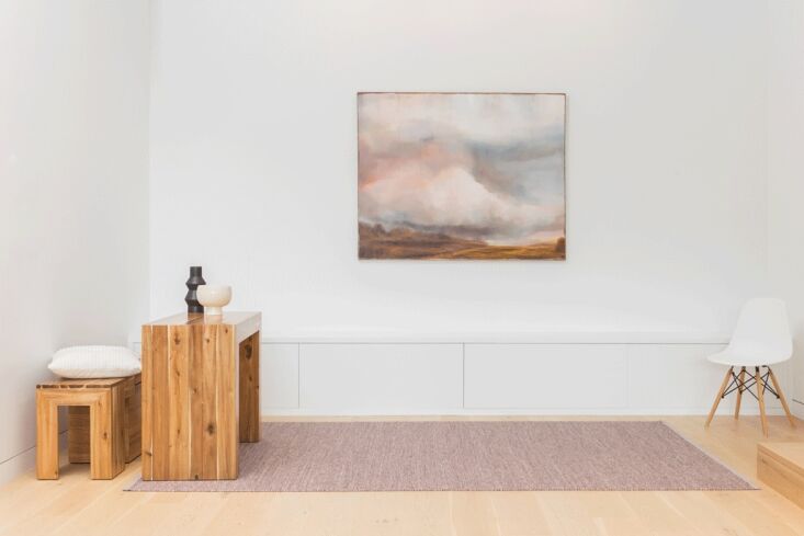 The Transformer Table console being used as a minimalist work-from-home desk with a laptop.