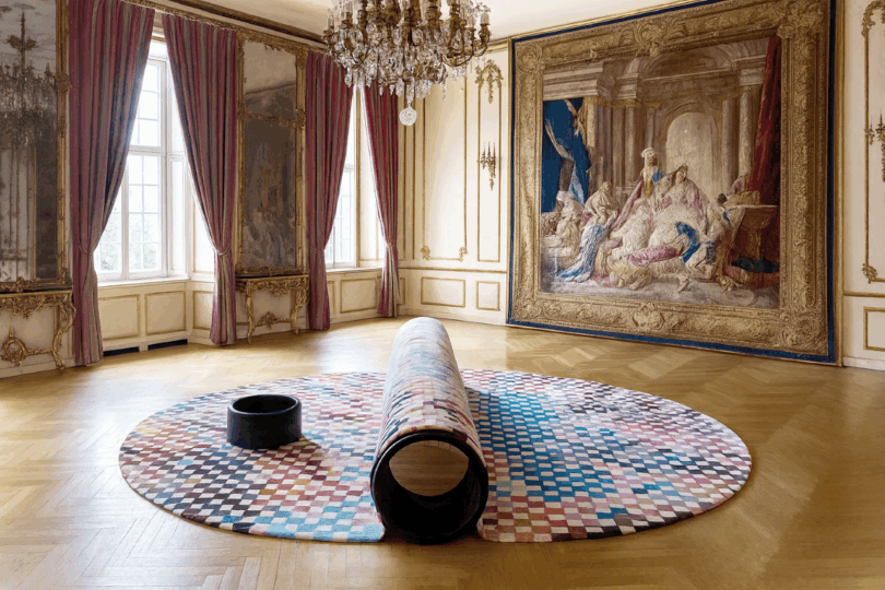 Arnaud Lapierre's RONDIN installation on a parquet floor in a grand room with tapestries and chandeliers.