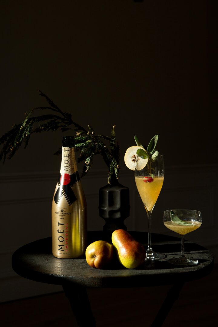 Champagne cocktails with fine bubbles served in vintage-inspired glassware.