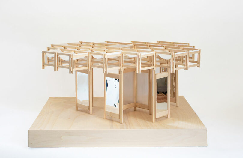 A wooden architectural model of the KlimaKover's modular grid system.