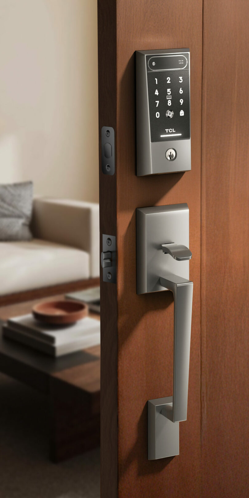 A partially open door with the TCL D2 Pro lock installed, looking into a cozy living room.