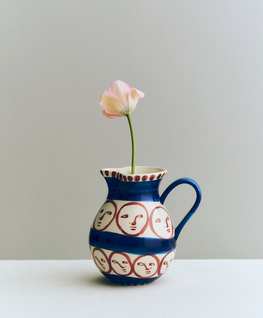 The La Faccia Jug with a painted face and a distinctively shaped handle.