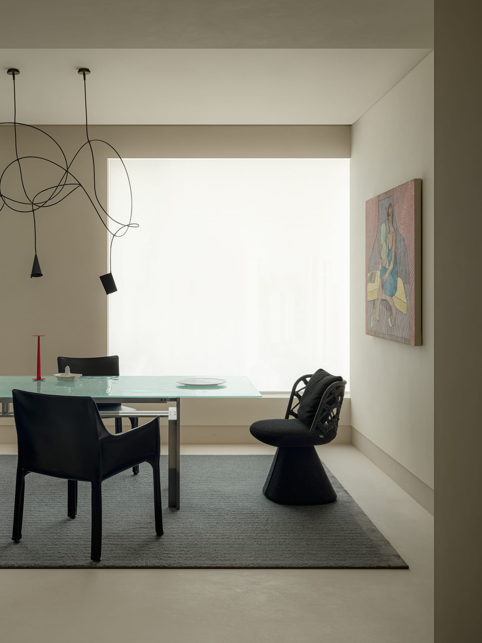 A view through a narrow corridor showing glimpses of greenery and light at the end of the path.