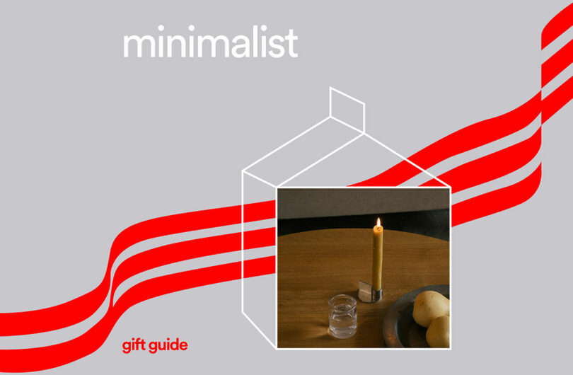 Minimalist table setting with a candle, pears, and glassware on a wooden surface.