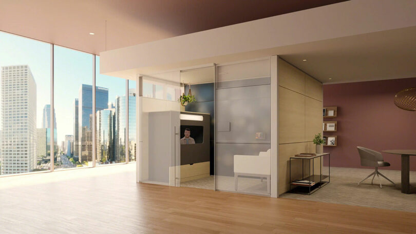 A modern office with city views featuring an Ocular View pod as part of a comprehensive hybrid work environment.