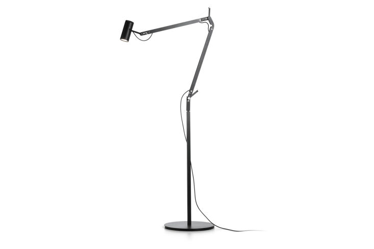 A sleek black Marset Polo floor lamp standing in a modern living space.