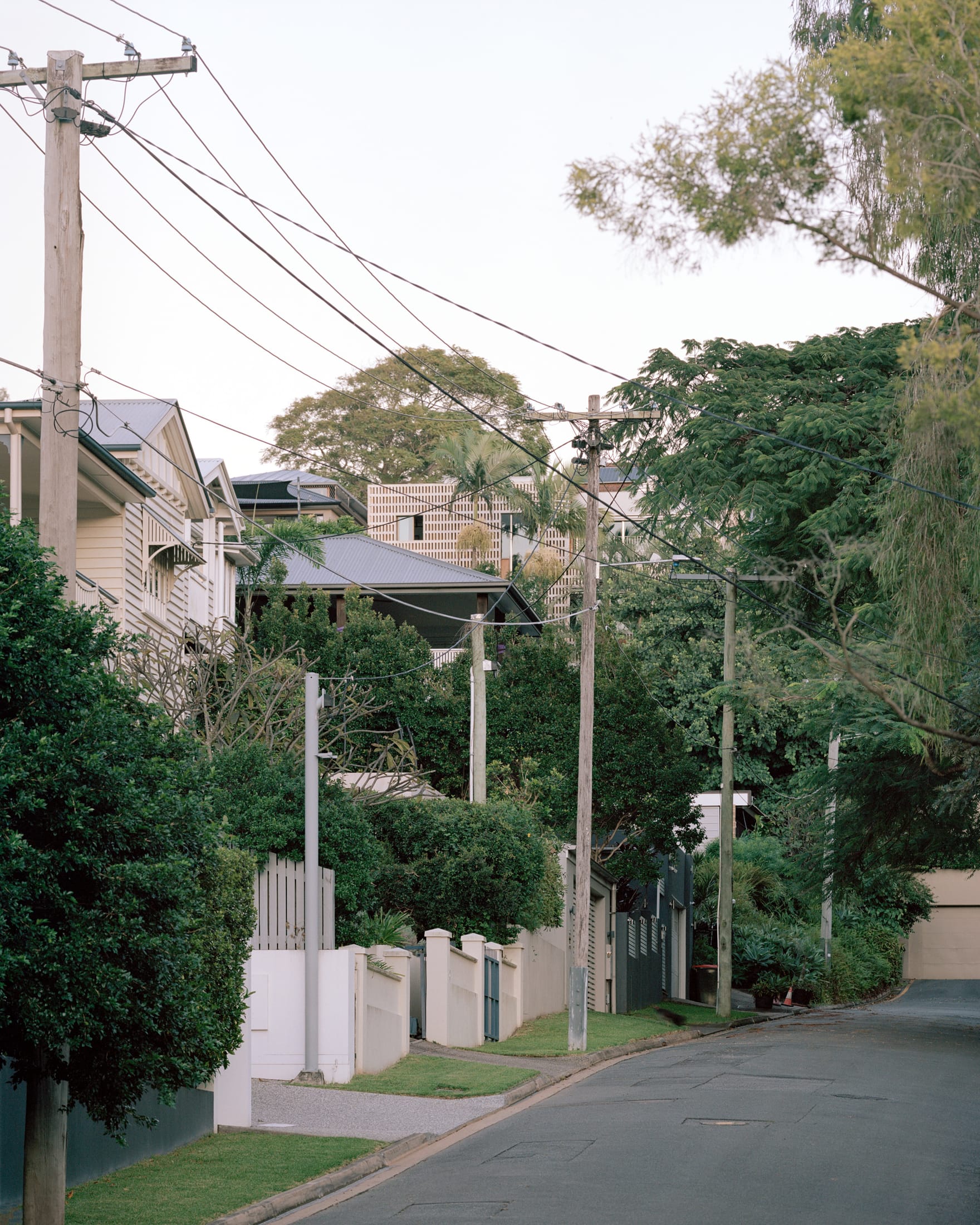 Evening shot of the Birdwood House highlighting its monolithic and fire-resistant masonry structure.