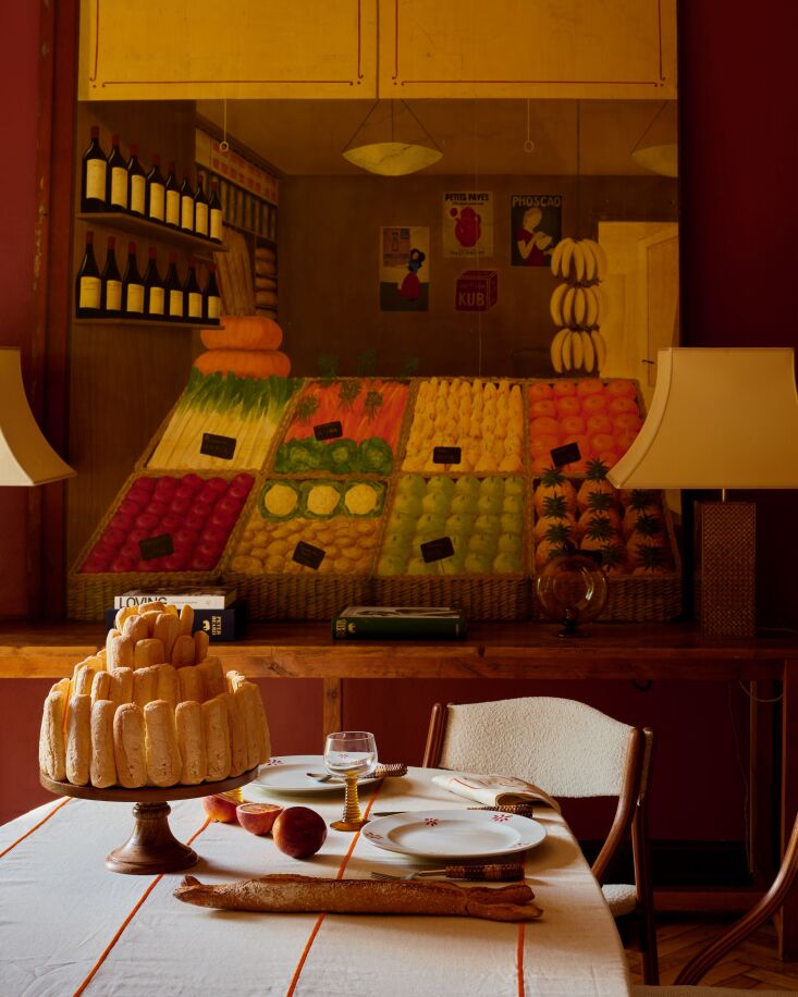 Embroidered striped tablecloth and matching linen napkins.