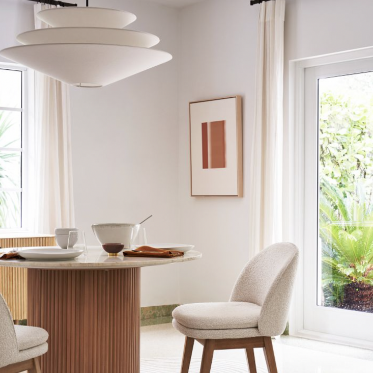 The West Elm Gull Pendant, a 32-inch diameter tiered light fixture.