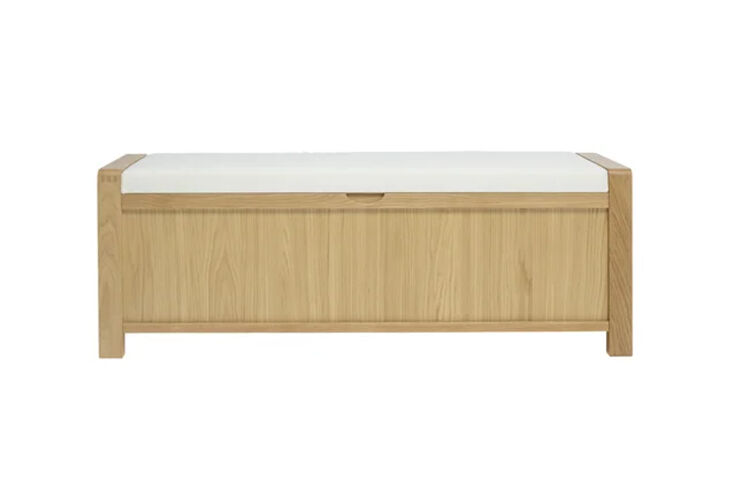 A wooden storage bench with the lid open, revealing three distinct interior compartments.
