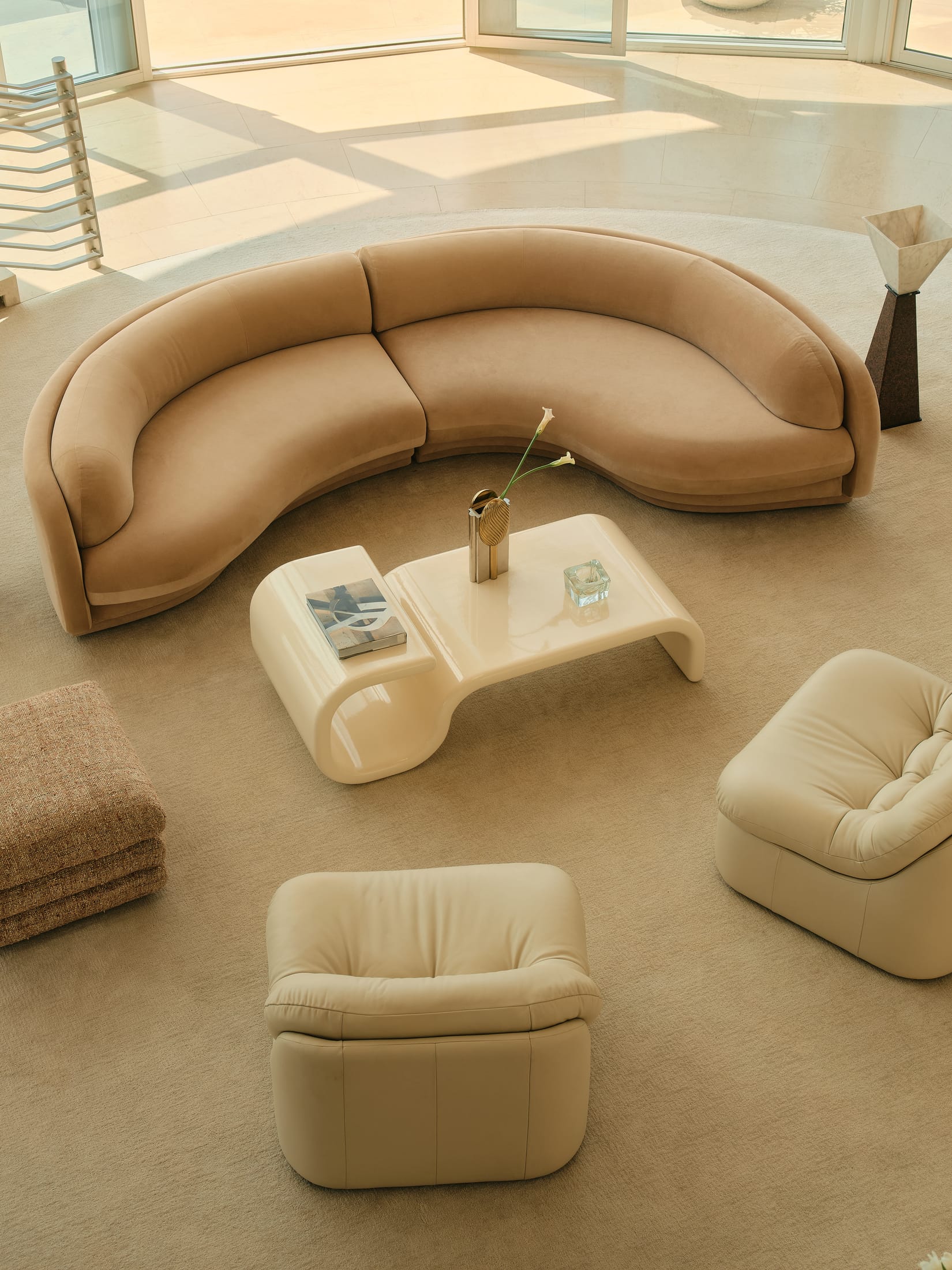 Detailed side profile of the Poet Sofa showing its unique asymmetrical and curved frame.