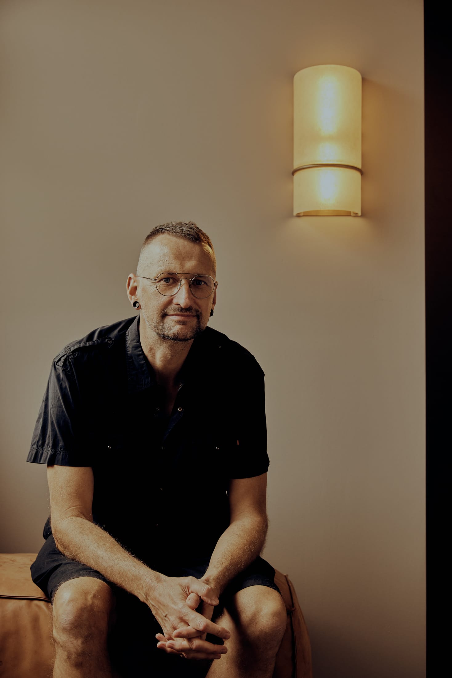 Portrait of designer Volker Haug in a studio setting.