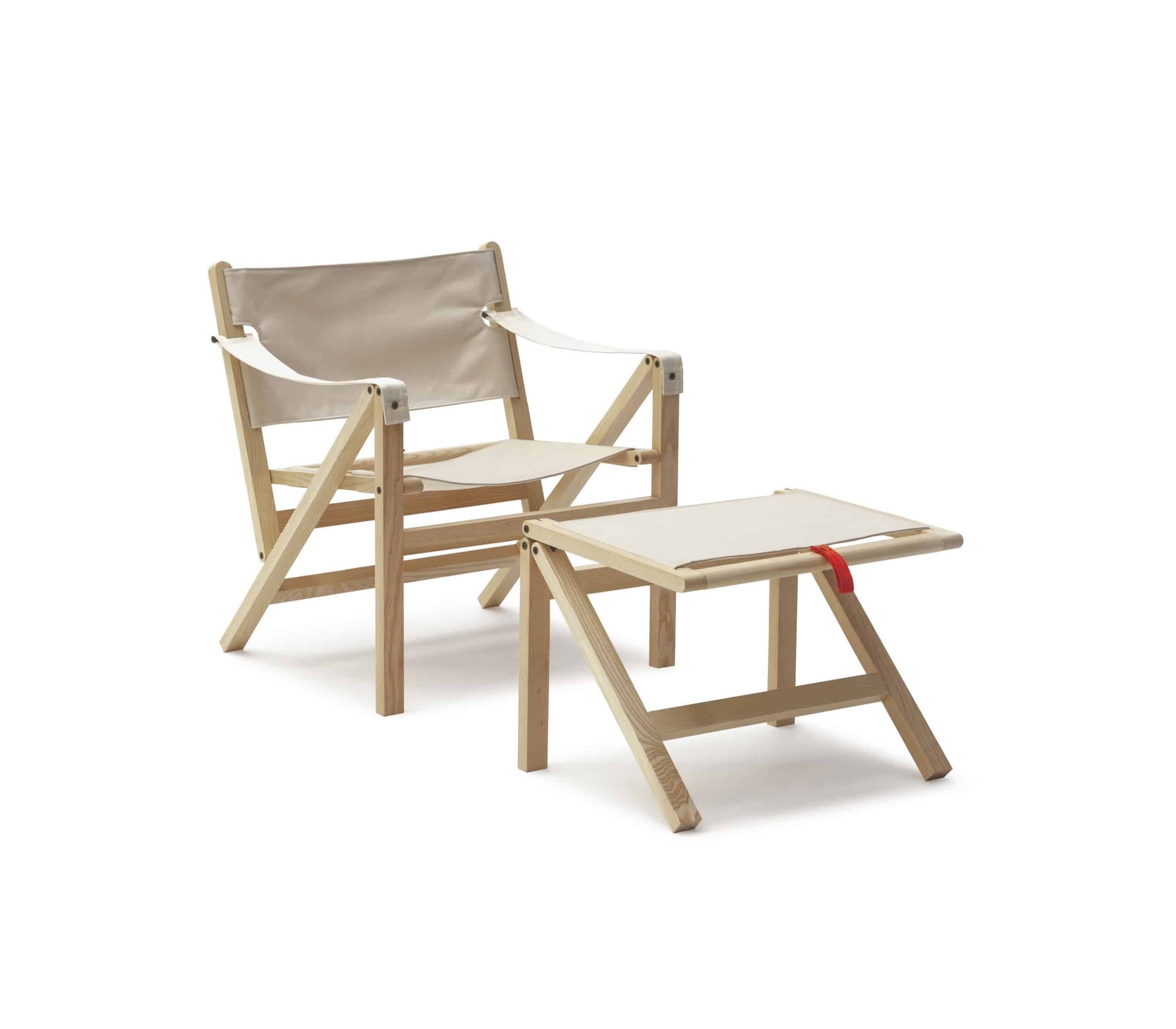 A contemporary safari-style folding chair and matching ottoman made of light wood and white canvas.