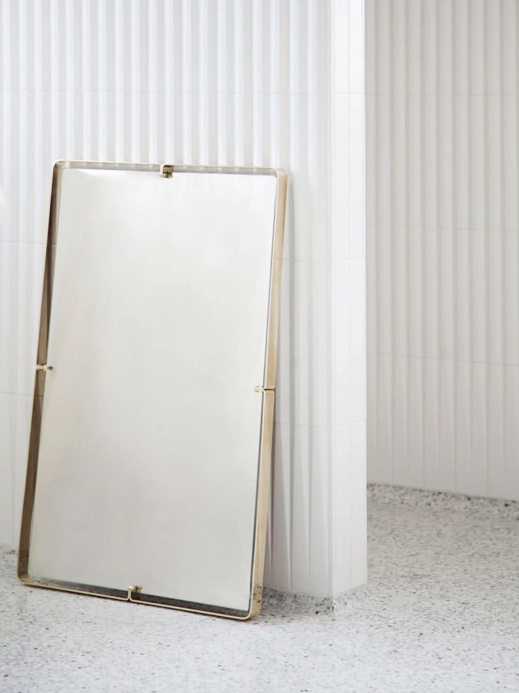 A large rectangular Heritage mirror with a luxury brass frame.