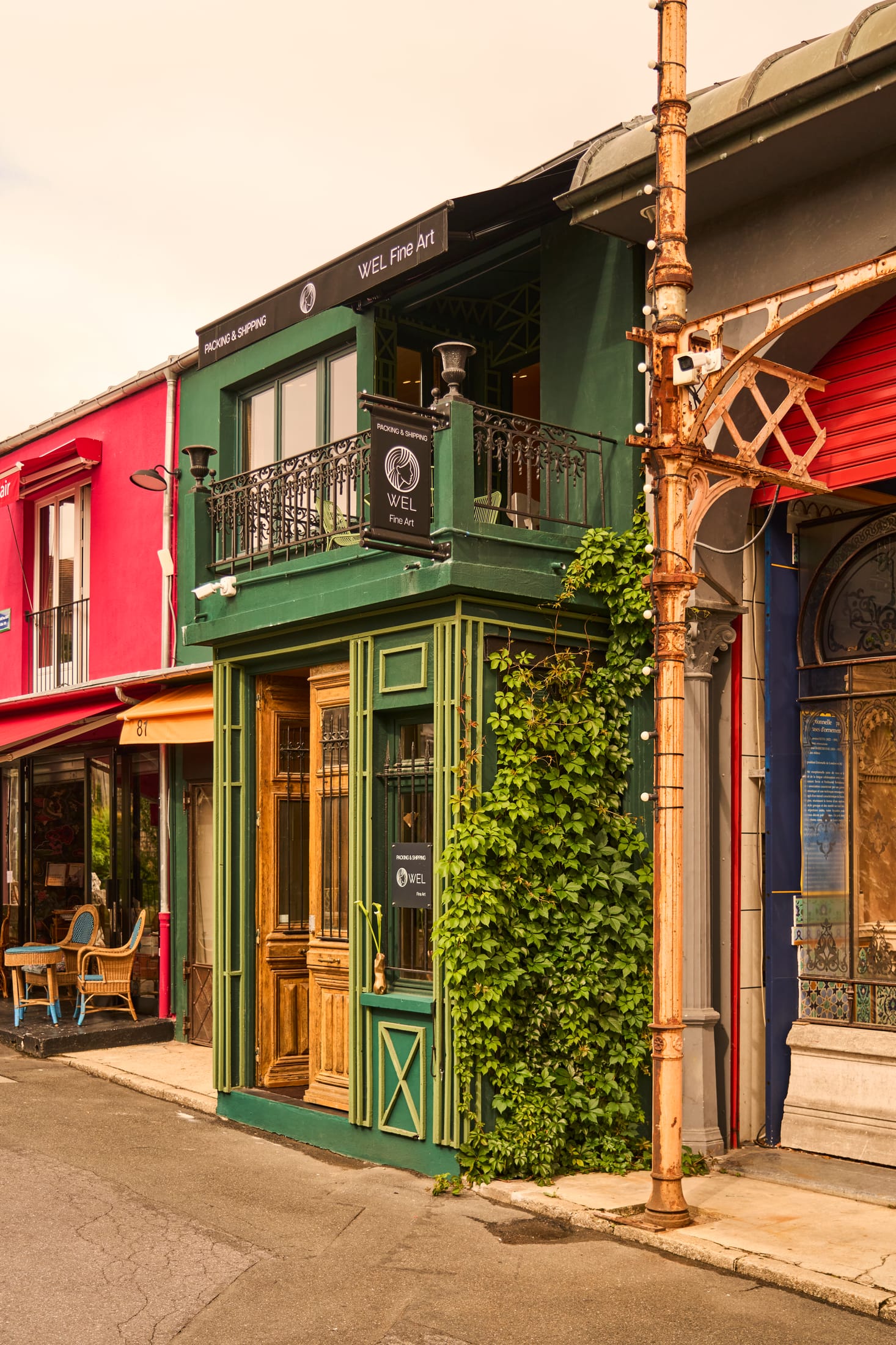 A curated arrangement of mid-century modern chairs and contemporary art in an open floor plan.