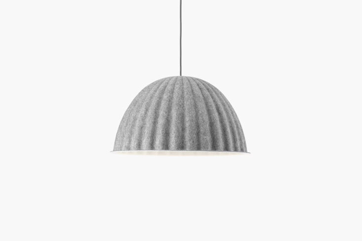 The Muuto Under the Bell Pendant in a neutral grey felt material.