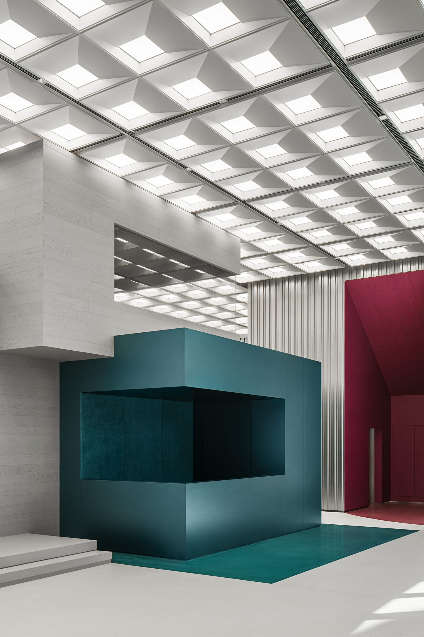 A high-ceilinged multifunctional lobby with modular stacking elements and a professional lounge area.