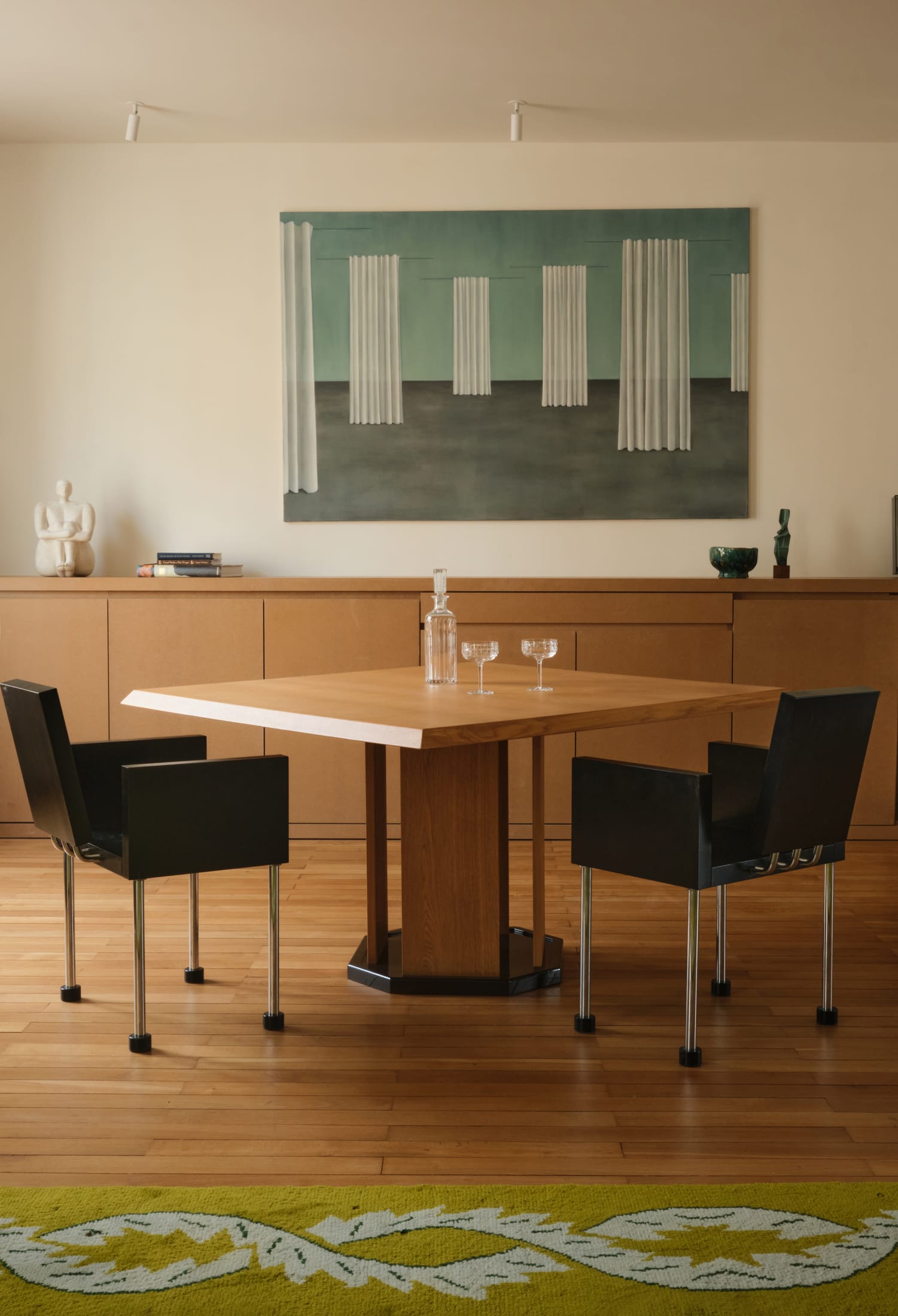 A hallway featuring floor-to-ceiling timber cladding and integrated lighting.