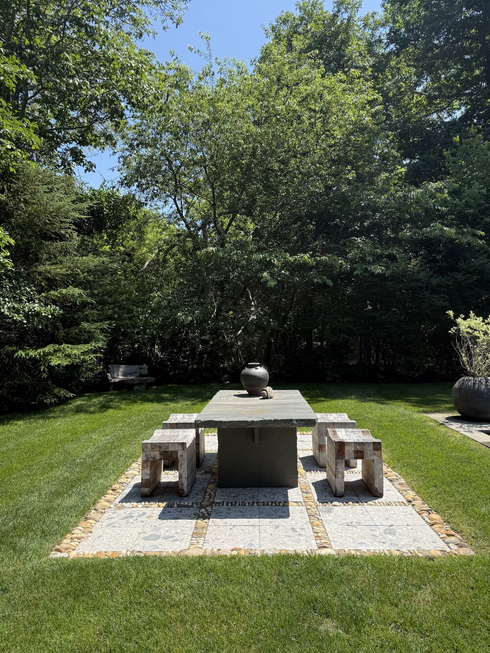 A well-defined outdoor lounge area with structured furniture and clear spatial boundaries.