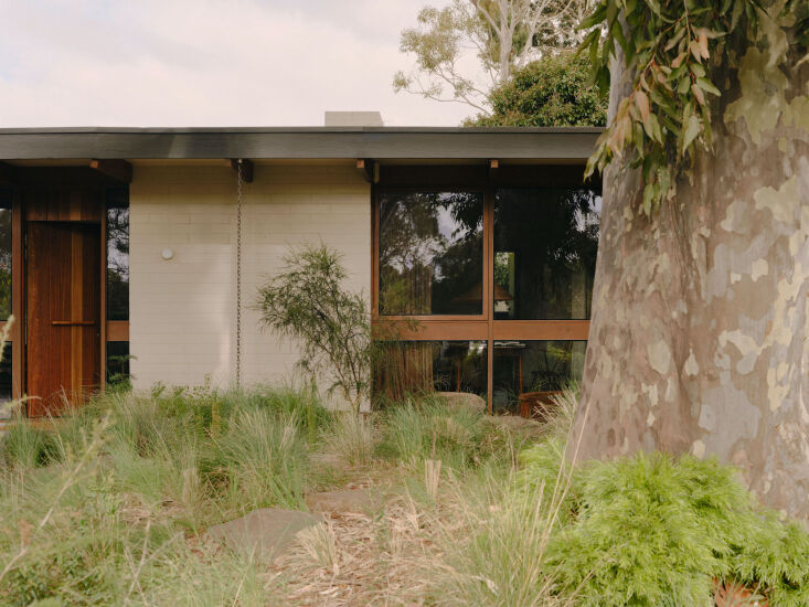 Exterior detail of the original cedar window frames, now updated with sustainable double glazing.