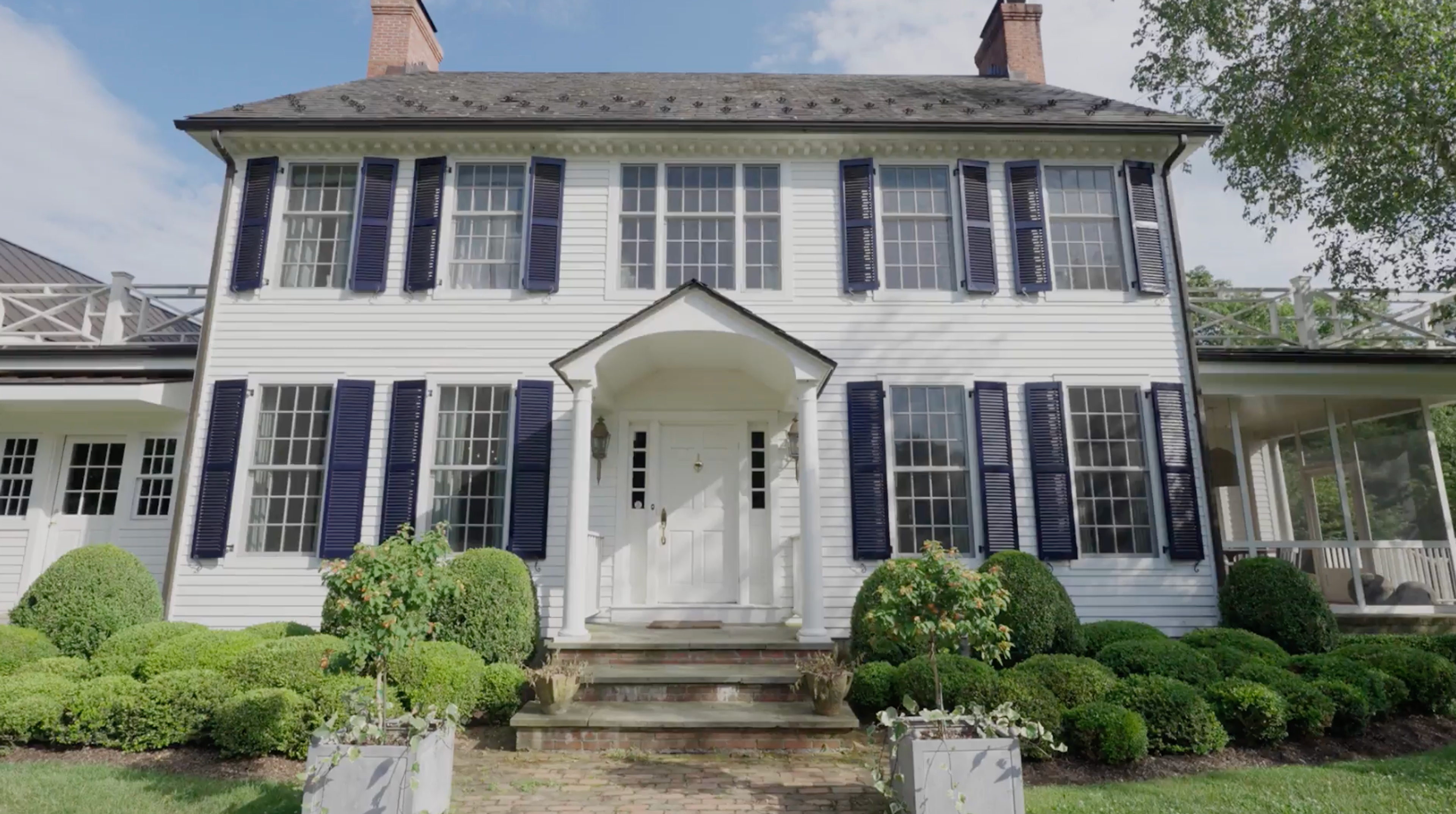 The exterior entrance of Julia Brown's traditional shingle-style home in Millbrook.