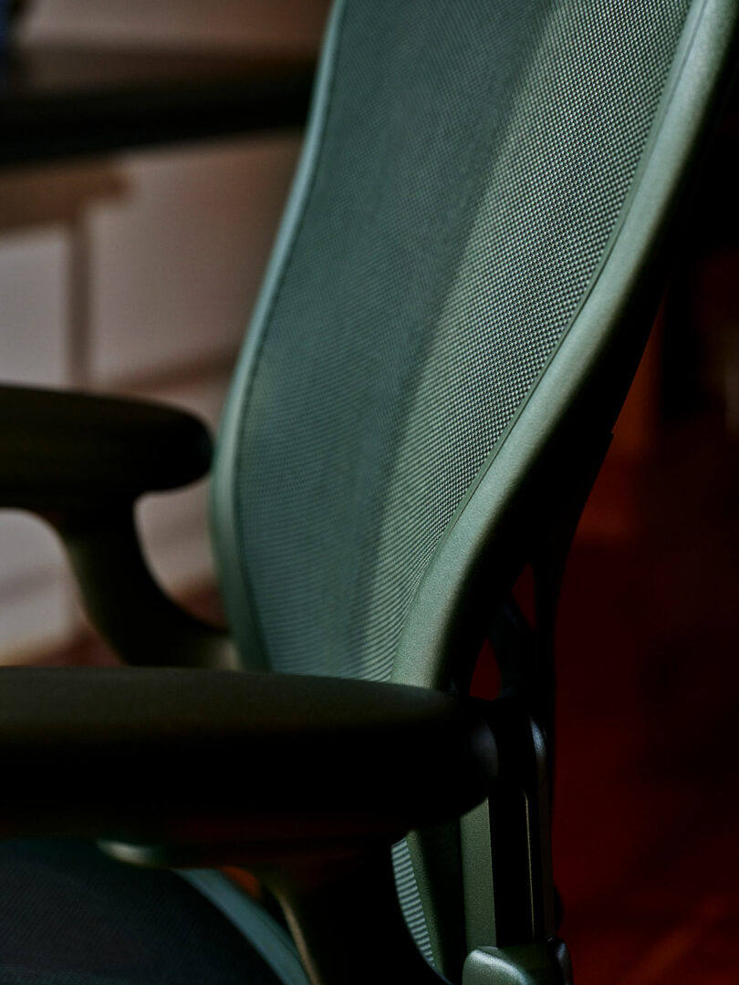 Close-up of the breathable Pellicle mesh backrest on an Aeron office chair.
