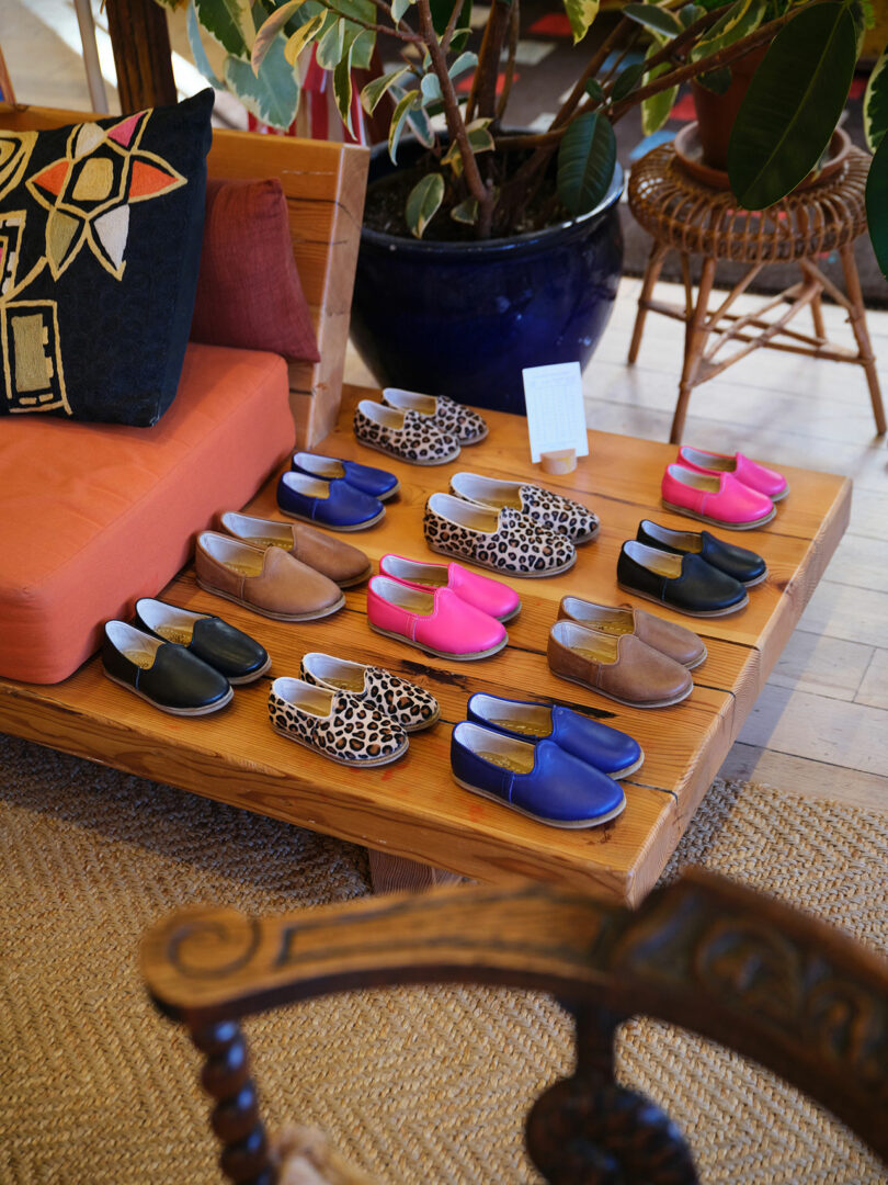 A collection of children's slip-on shoes in various patterns and colors.