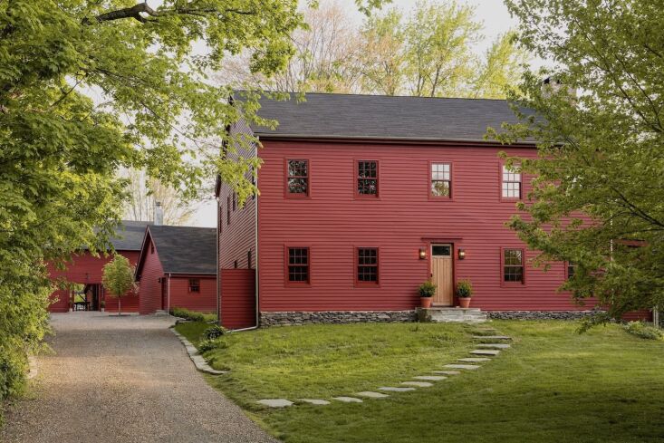 Exterior view of the 1910 Barnswood farmhouse and its surrounding landscape in Germantown, NY.