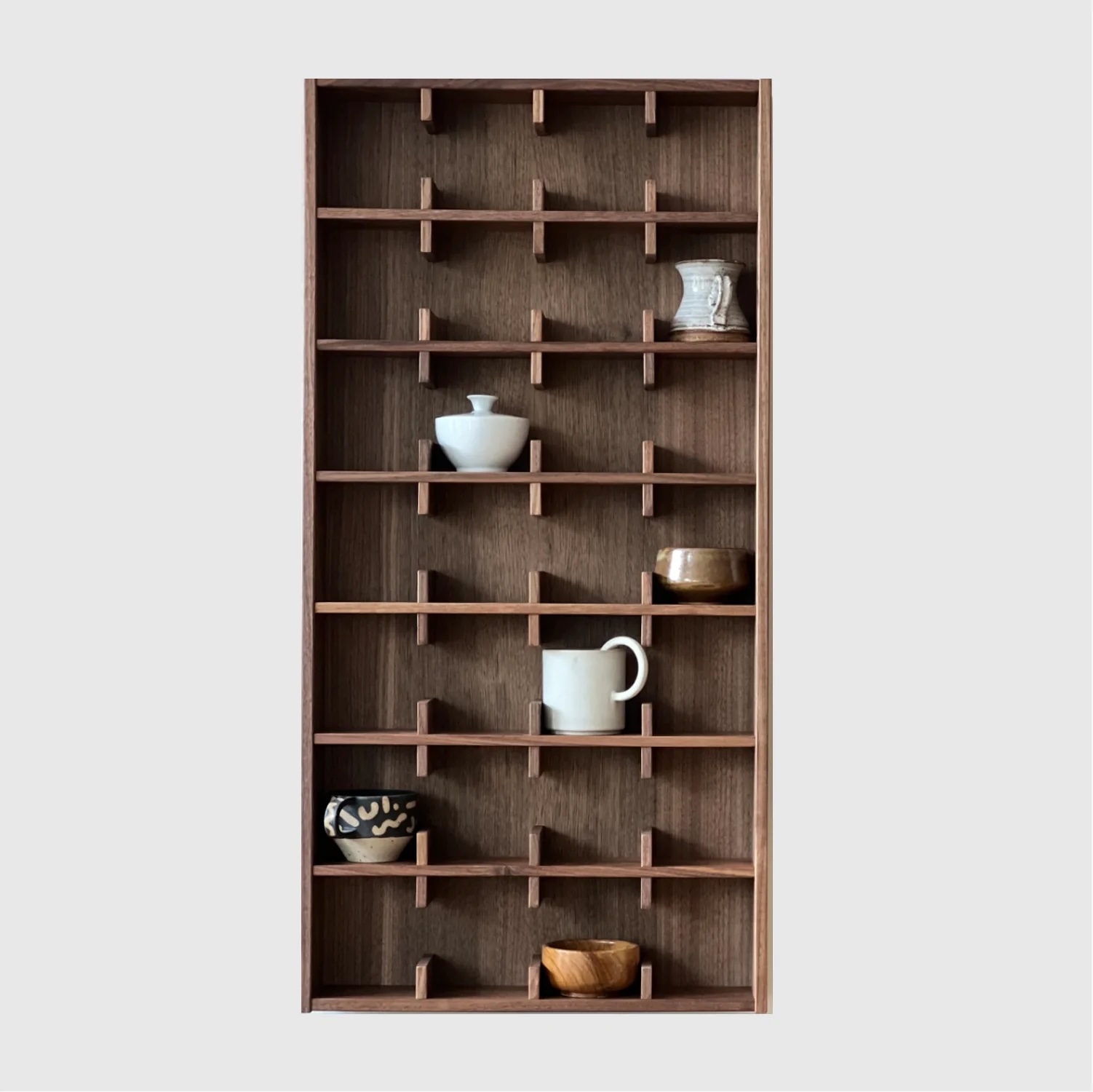 The large Sætter 7 shelf in a dark walnut wood finish.