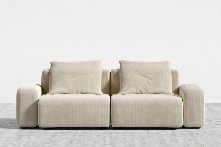A large sofa in Silkstone light grey corduroy.