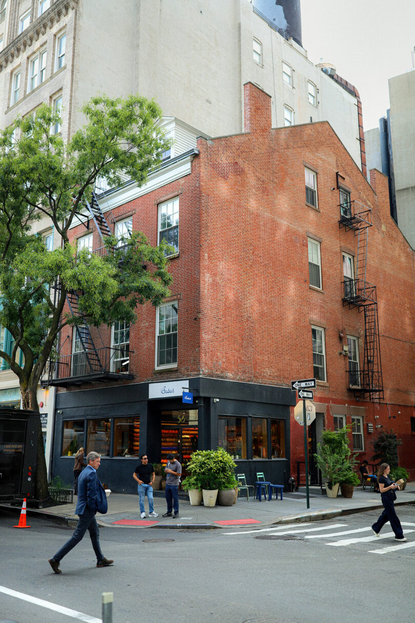 Exterior view of the historic 1823 Flemish red brick building at 56 Bleecker Street.