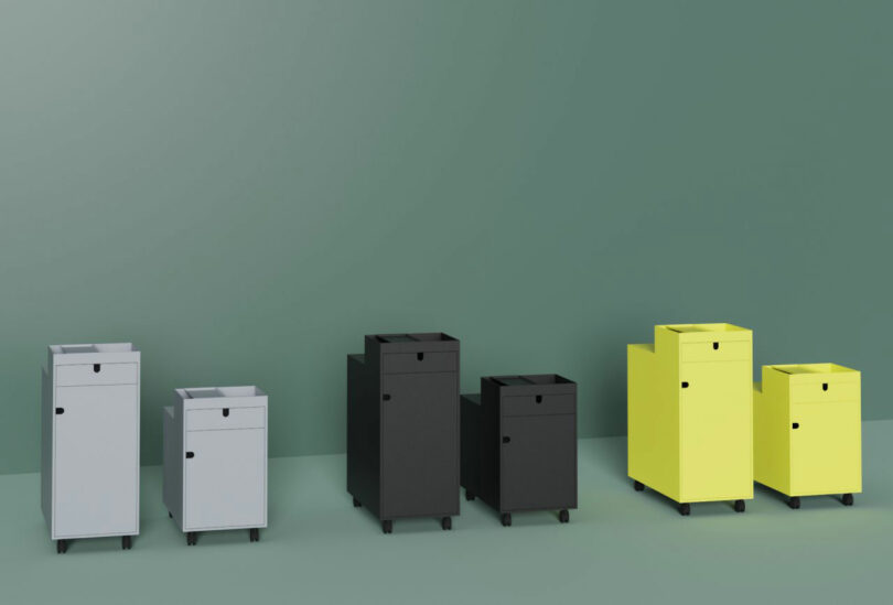 A row of NEXT trolleys in gray, black, and yellow, showing different height configurations.