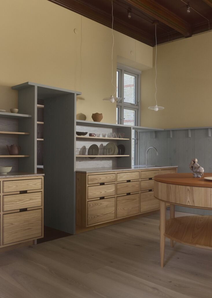 Detail of Hoelgaard splined cut drawers, Portland Taupe Sandstone countertop, and John Pawson fixtures.