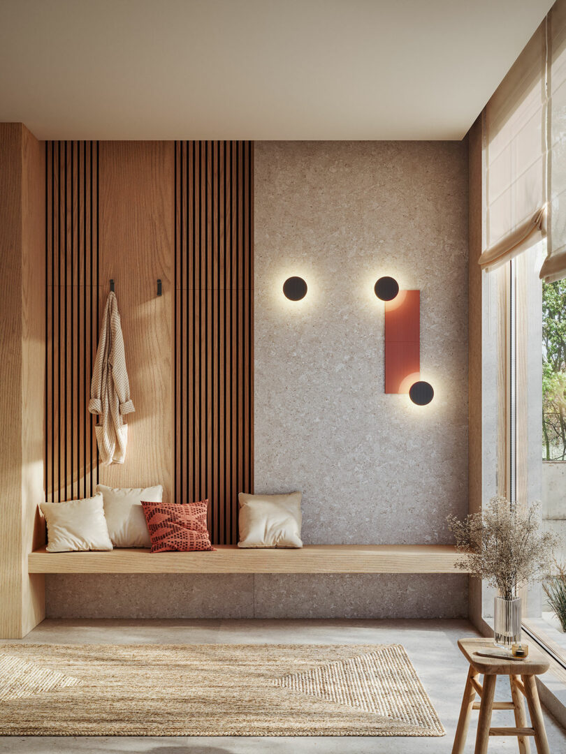 A minimalist modern entryway featuring a wooden bench and minimalist ARID wall lights casting a soft glow.