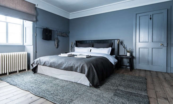 The Birch room featuring layers of cool blue and gray tones with minimal lighting.