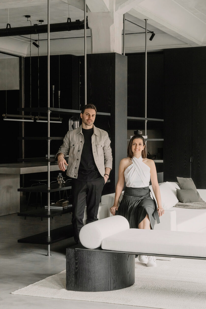 Founders of OZA Design, Özge Öztürk and Alexandre Simeray, posing in the minimalist Milo Apartment.