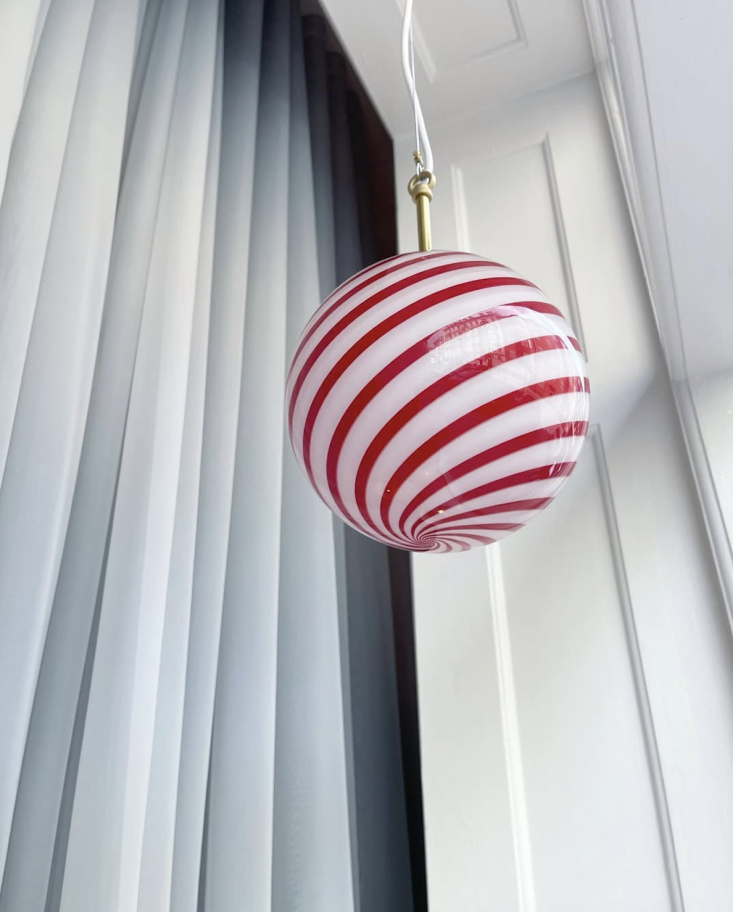 A large Murano vintage candy pendant light with red and white glass stripes.
