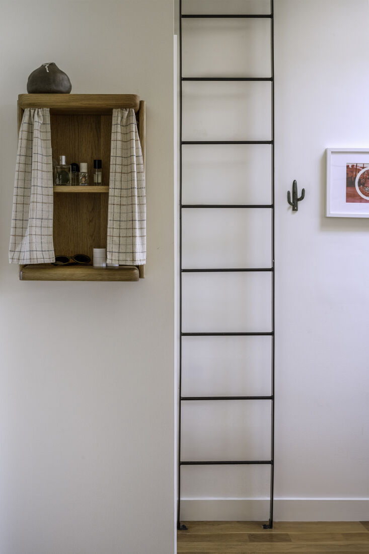 The Nook Curtain Table mounted on a wall as a floating shelf without its legs.