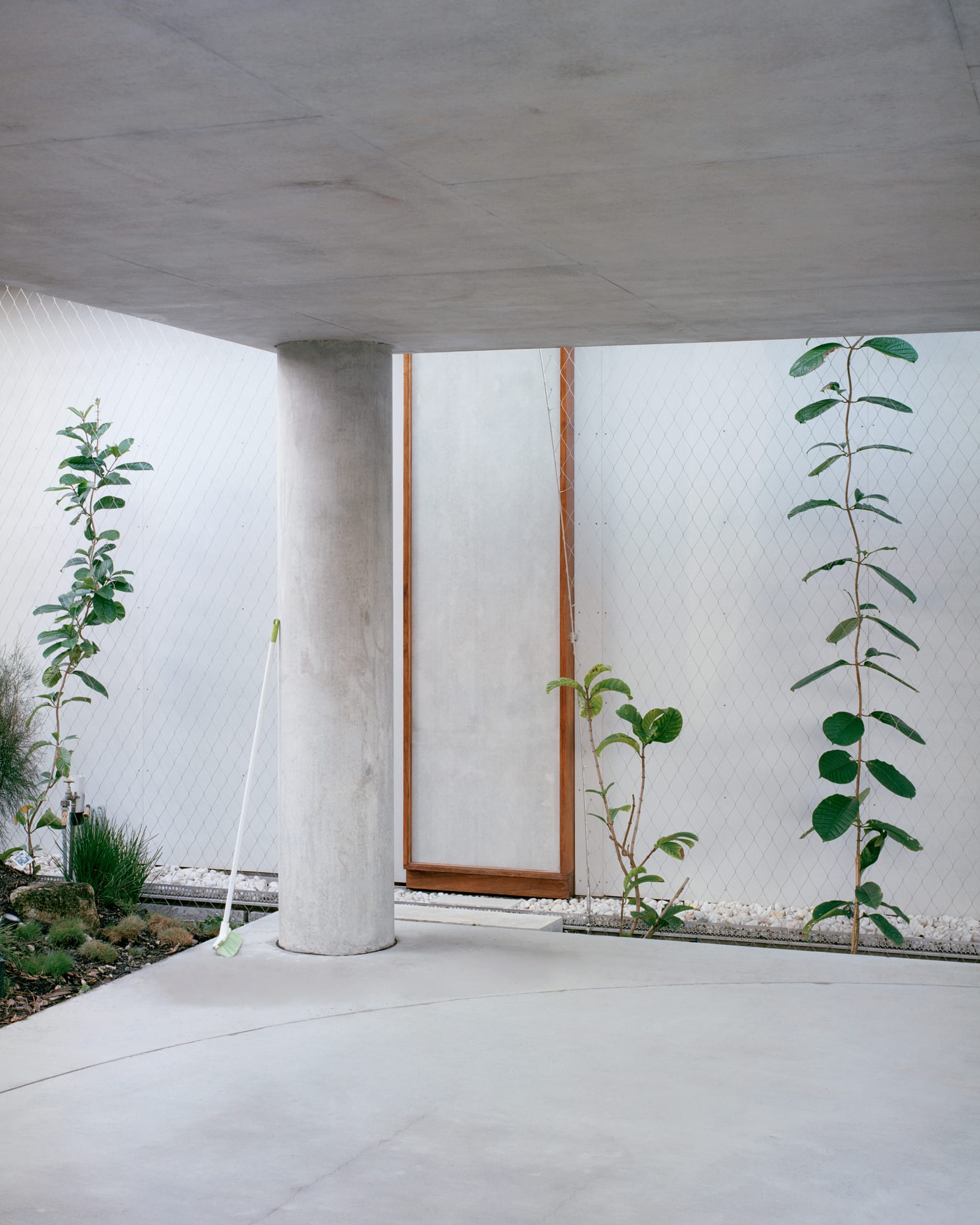 Wide architectural shot of the Peter Besley Birdwood House nestled in the Brisbane hillside.