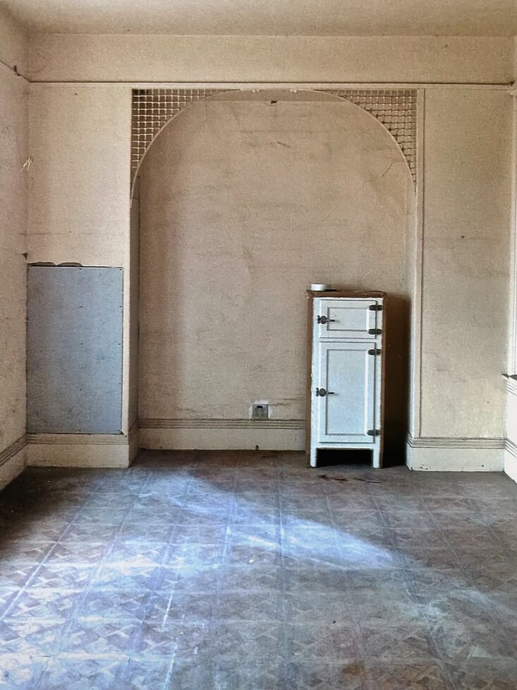 Close-up of restored white fretwork and historical wainscoting details.